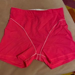 Vibrant Pink Athletic Shorts with Curved Seams
